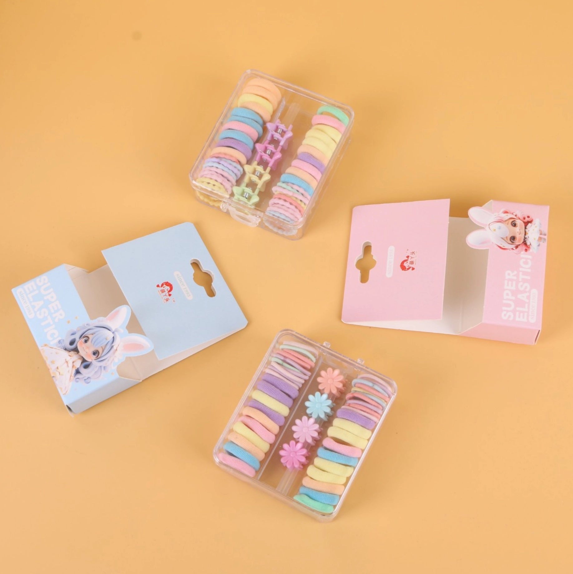 fondo tomate con Ligas elásticas de colores en caja cuadrada pequeña, resistentes y prácticas. Se venden al por mayor para tiendas y distribuidores.