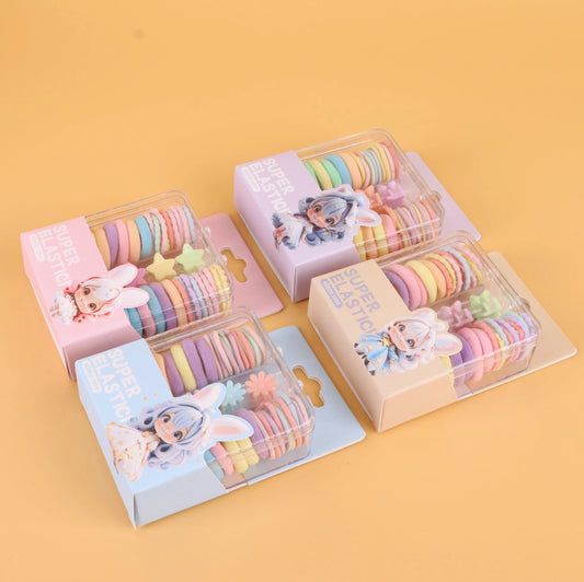 fondo tomate con Ligas elásticas de colores en caja cuadrada pequeña, resistentes y prácticas. Se venden al por mayor para tiendas y distribuidores.